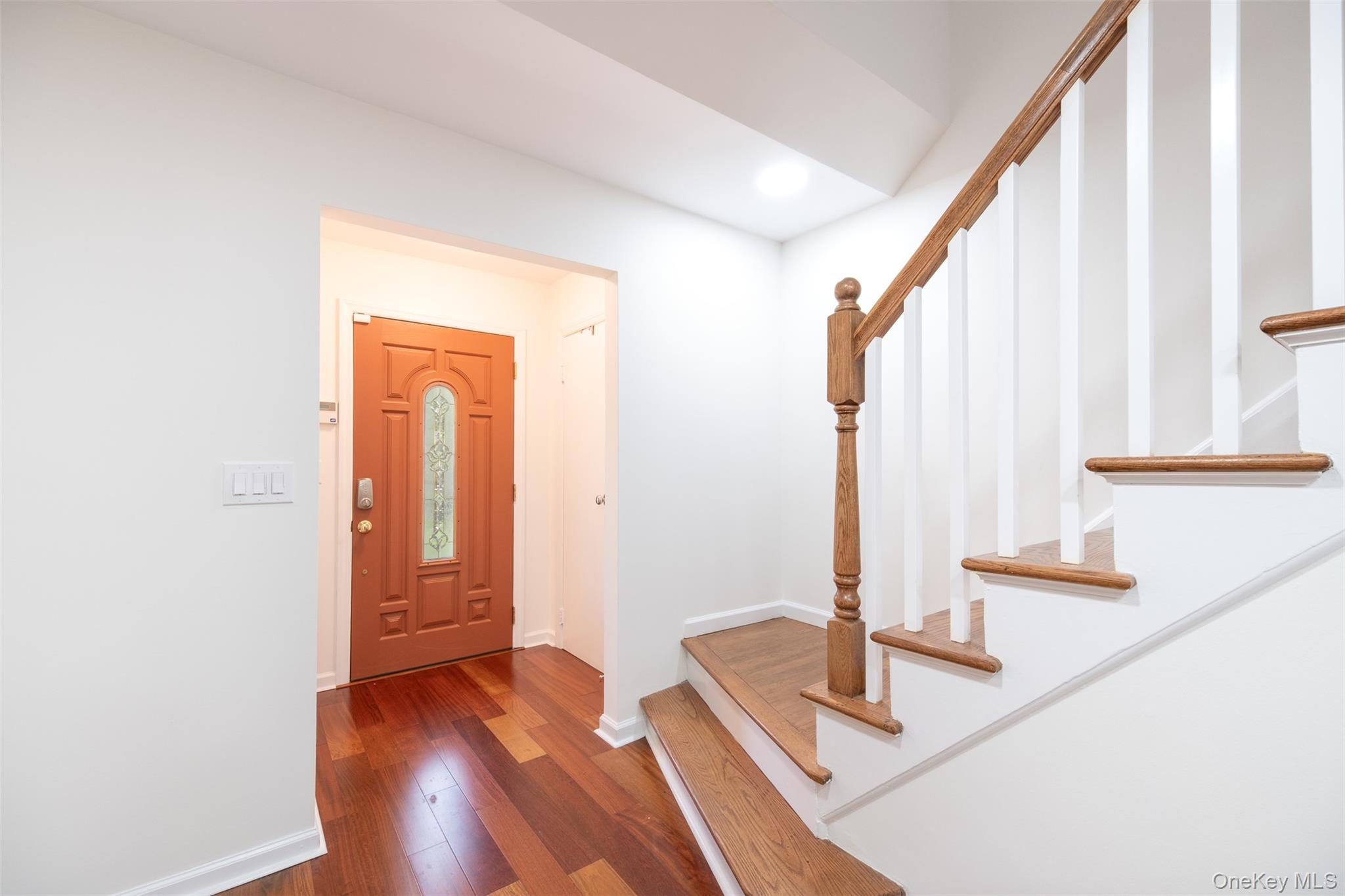 24 Sheldrake Place New Rochelle, NY 10804 - Photo 12 of 26 Entryway with stairway, dark wood-style floors, baseboards, and recessed lighting