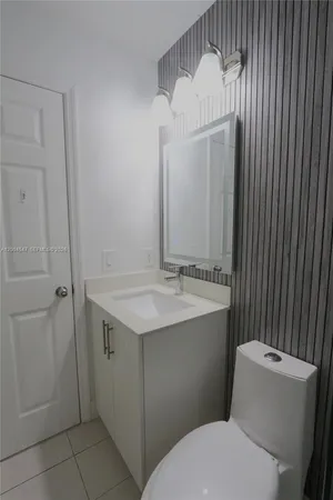a kitchen with a sink a refrigerator and a stove