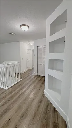 a bathroom with a shower a sink a toilet and mirror