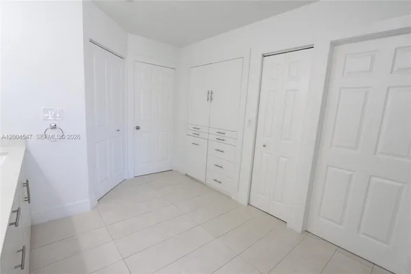 a bathroom with a double vanity sink mirror and