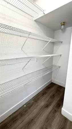 a view of an empty walk in closet