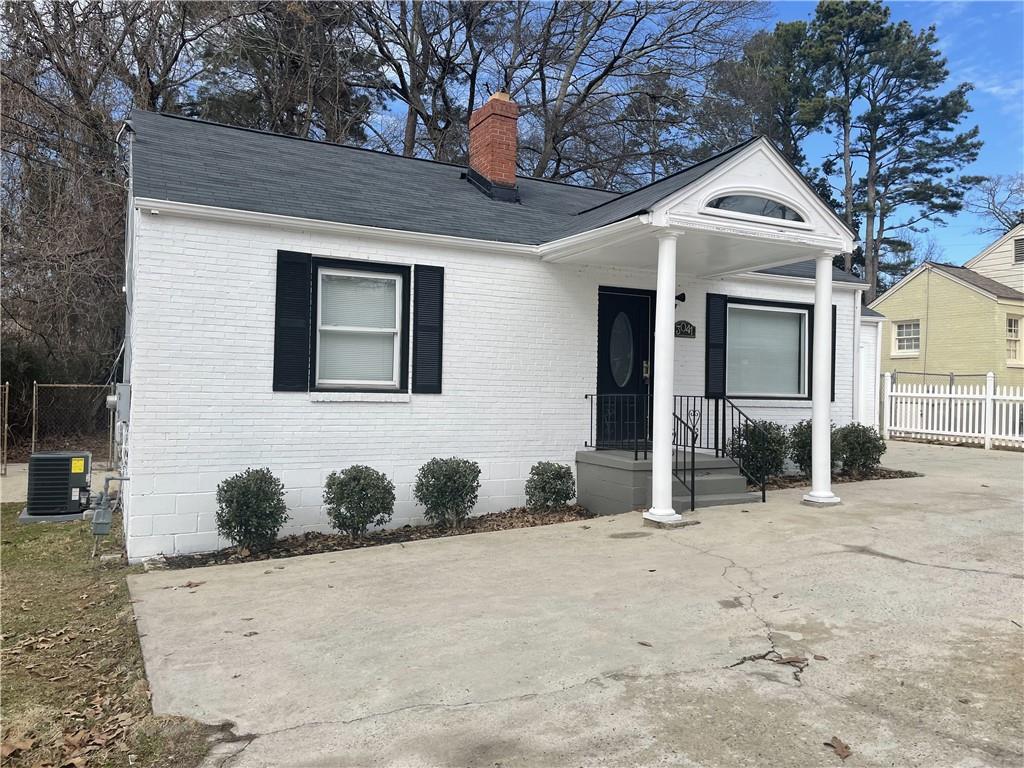 3041 Washington Road East Point, GA 30344 - Photo 1 of 1 a front view of a house with garden