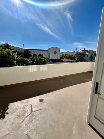 a view of a balcony with an outdoor space