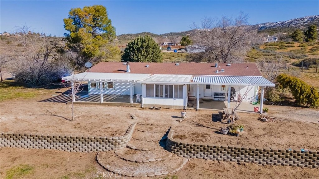 a view of a house with a snow in the background