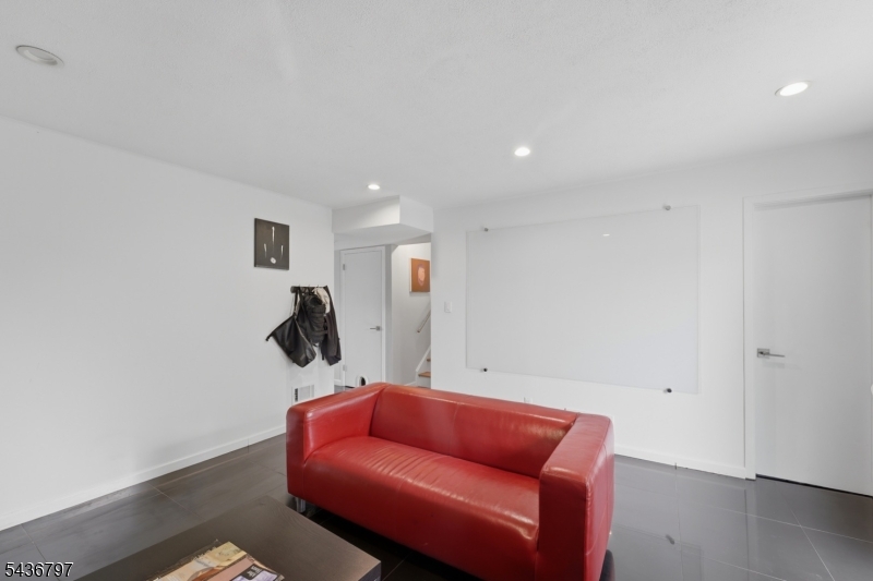 17 Arthur Drive Rutherford, NJ 07070 - Photo 18 of 45 a room with furniture and wooden floor