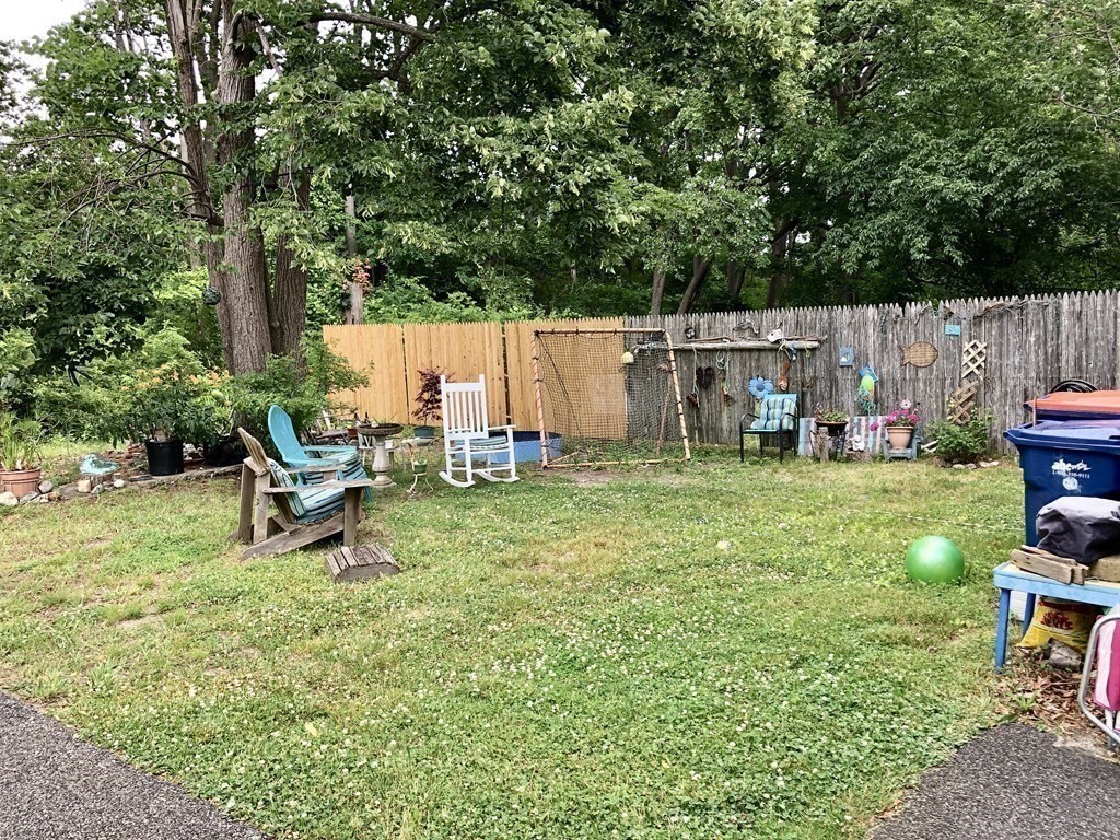 20-22 Hedge Road Plymouth, MA 02360 - Photo 27 of 29 a view of a backyard with chairs and a slide