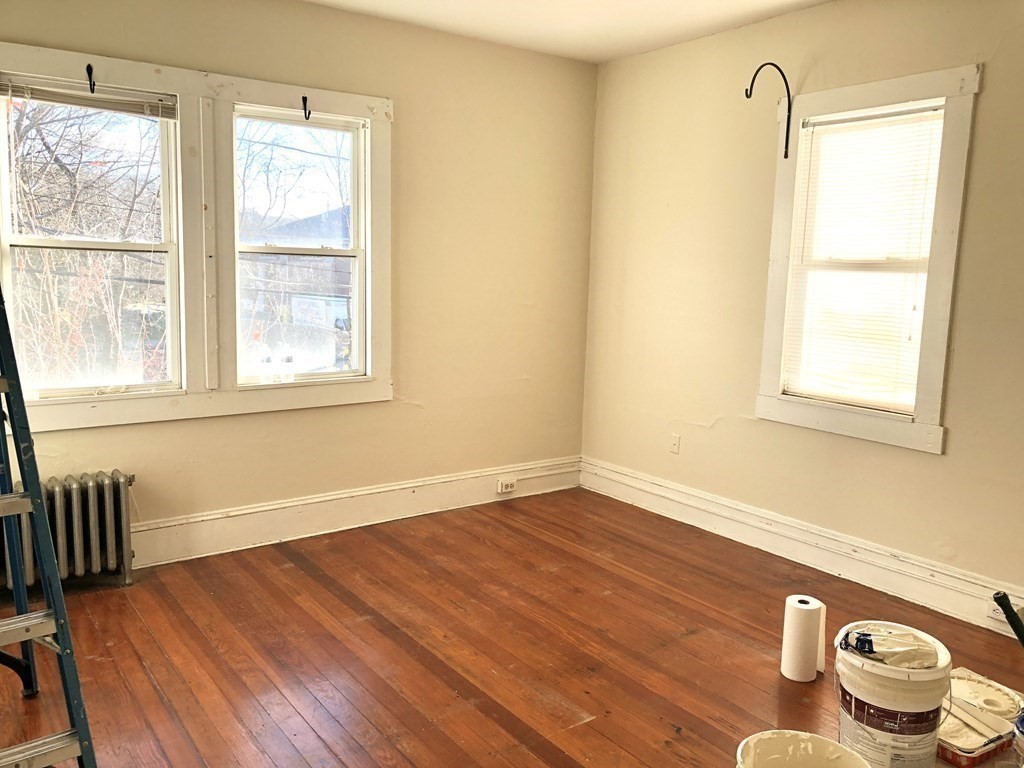 20-22 Hedge Road Plymouth, MA 02360 - Photo 10 of 29 a view of a livingroom with wooden floor and a window
