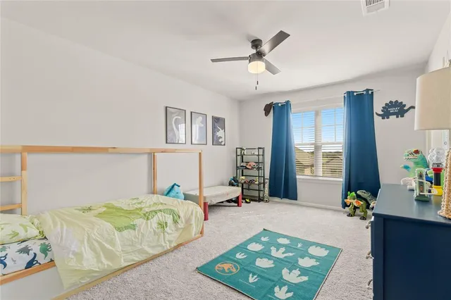 a bedroom with bed and window