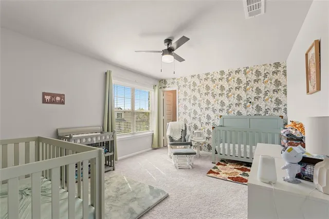 a bedroom with furniture and a window