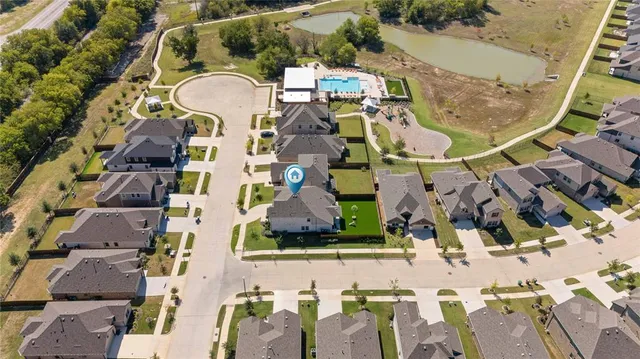 an aerial view of houses with outdoor space