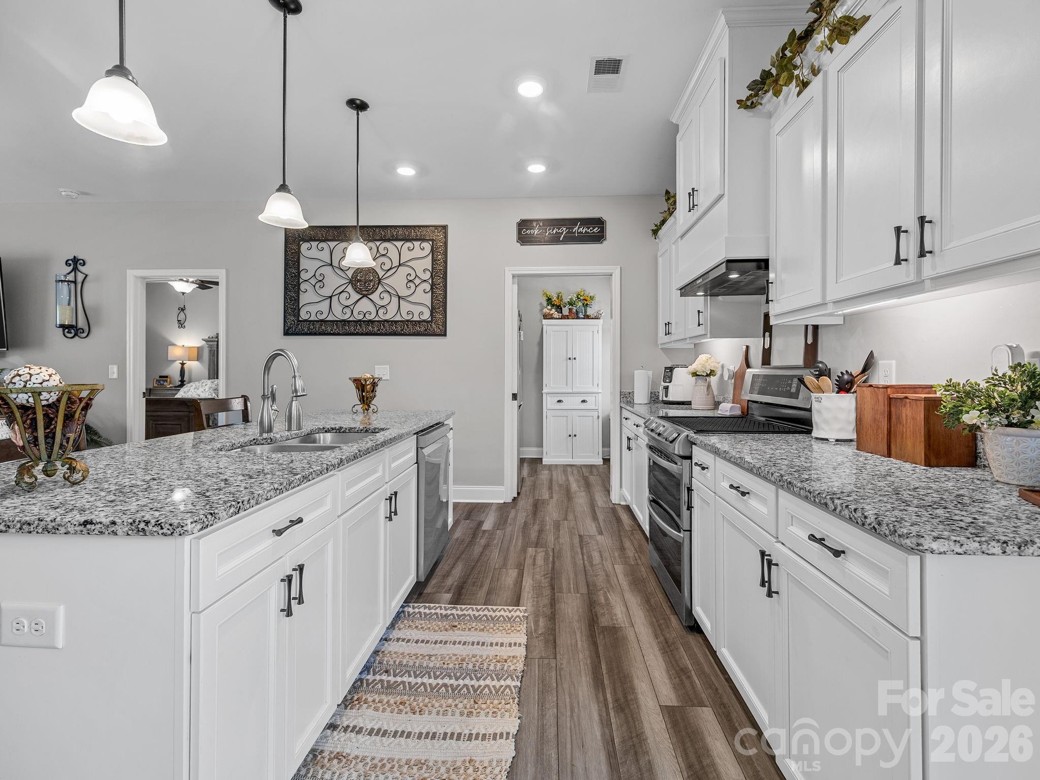 1076 McSwain Road Chesnee, SC 29323 - Photo 13 of 36 a large kitchen with stainless steel appliances granite countertop a lot of counter space