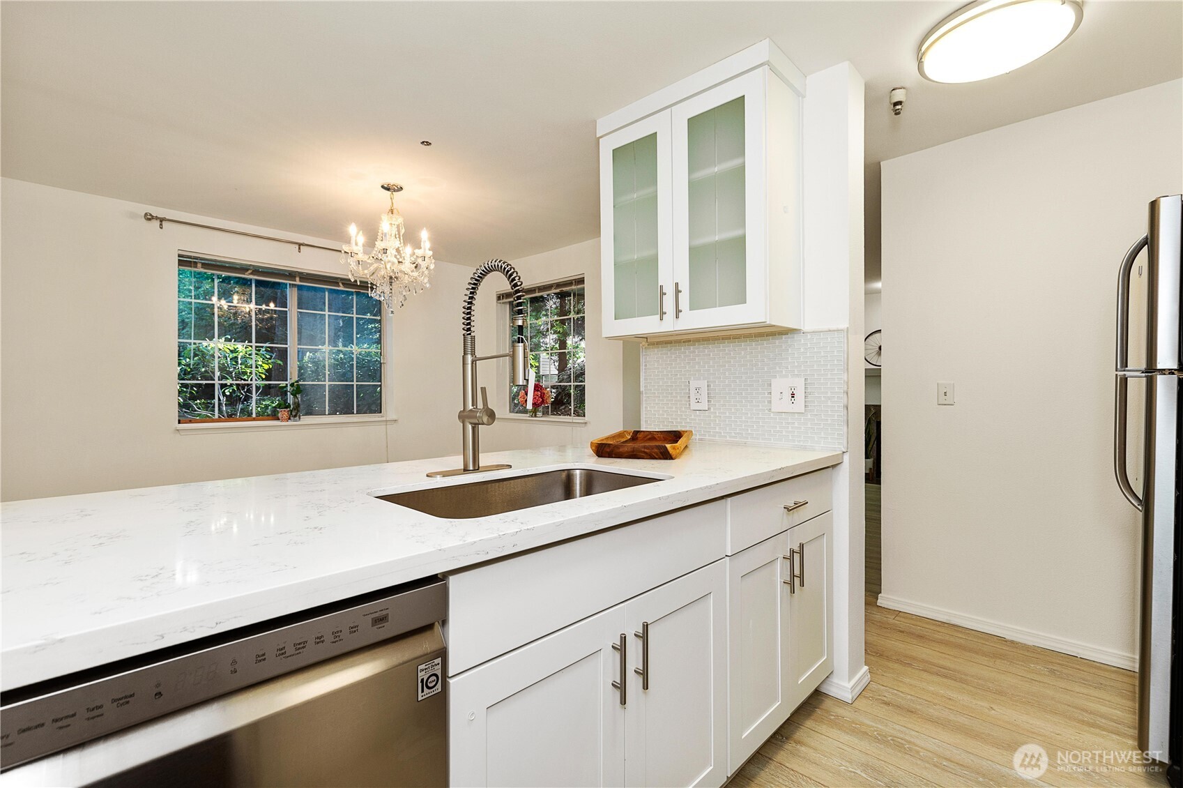 7453 Newcastle Golf Club Road, Unit G103 Newcastle, WA 98059 - Photo 14 of 37 a kitchen with a sink and a refrigerator