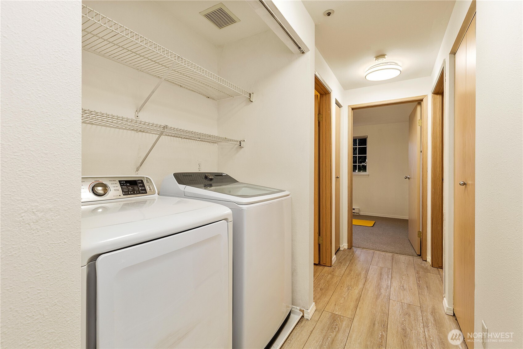 7453 Newcastle Golf Club Road, Unit G103 Newcastle, WA 98059 - Photo 15 of 37 a utility room with dryer and washer