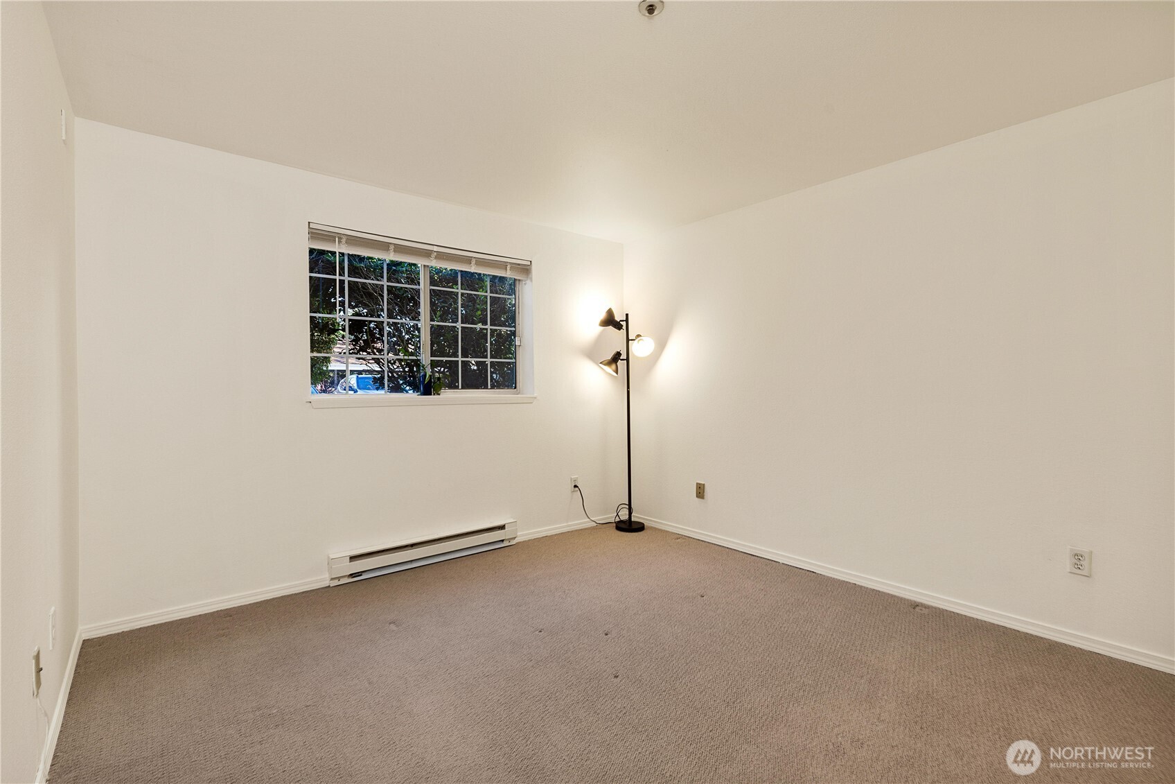 7453 Newcastle Golf Club Road, Unit G103 Newcastle, WA 98059 - Photo 18 of 37 an empty room with windows