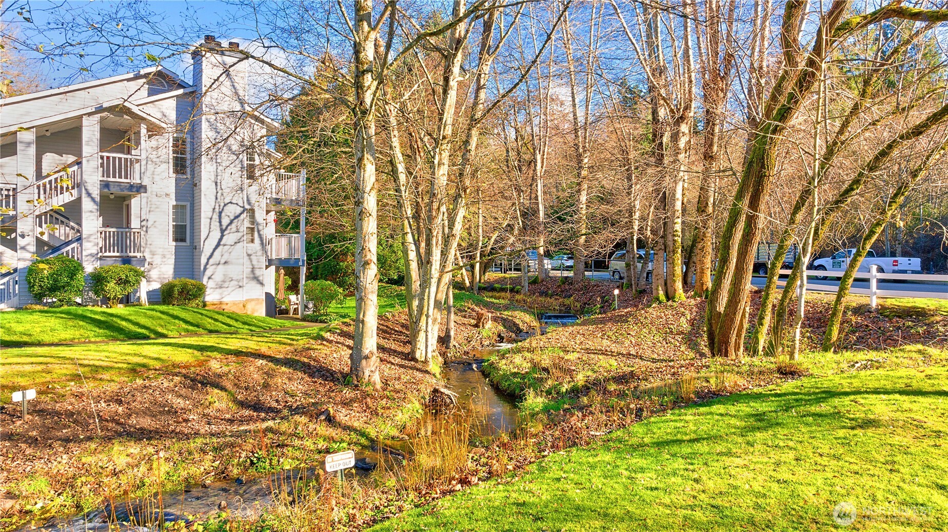 7453 Newcastle Golf Club Road, Unit G103 Newcastle, WA 98059 - Photo 25 of 37 a view of back yard of the house