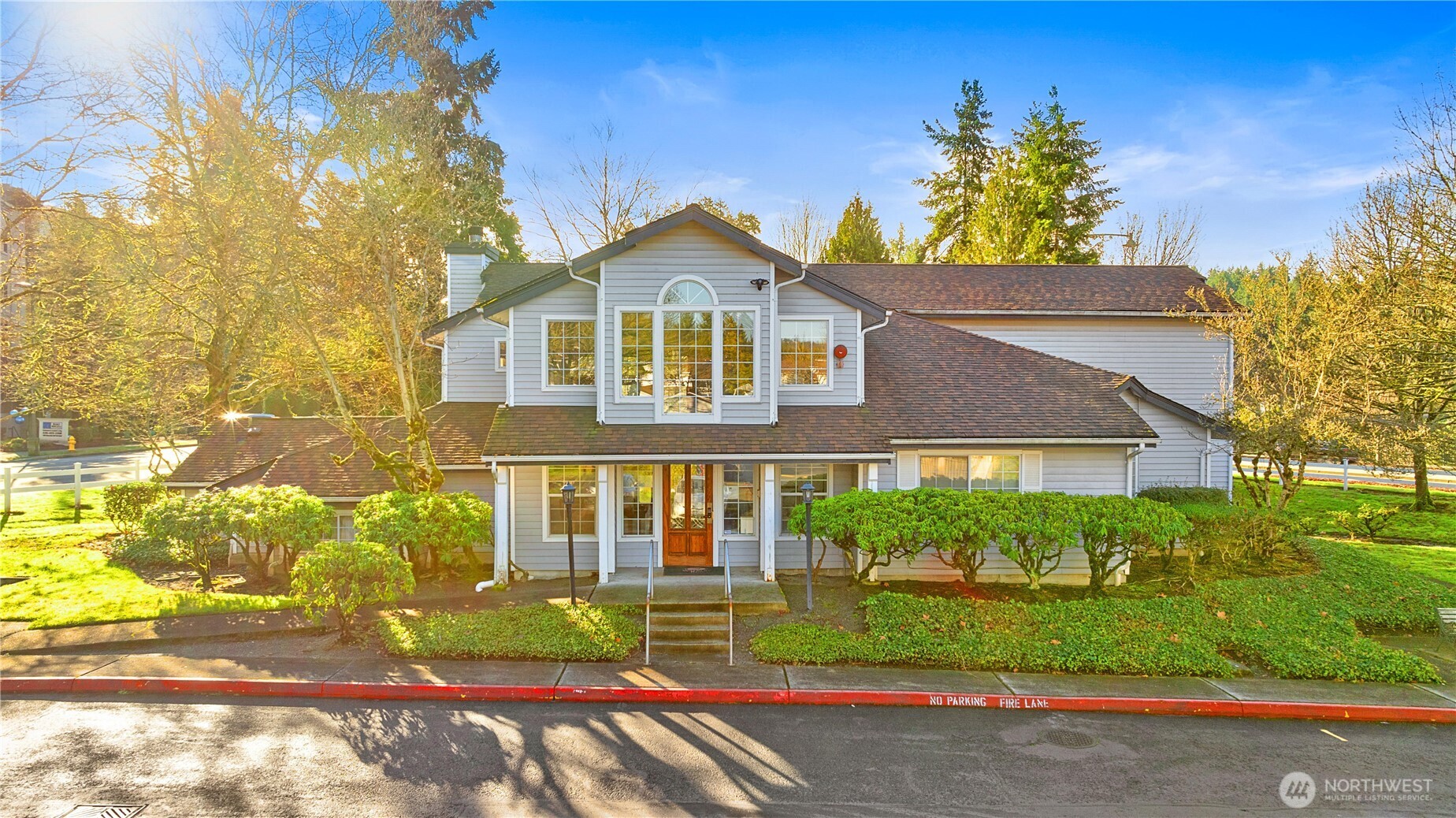 7453 Newcastle Golf Club Road, Unit G103 Newcastle, WA 98059 - Photo 27 of 37 a front view of a house with a yard