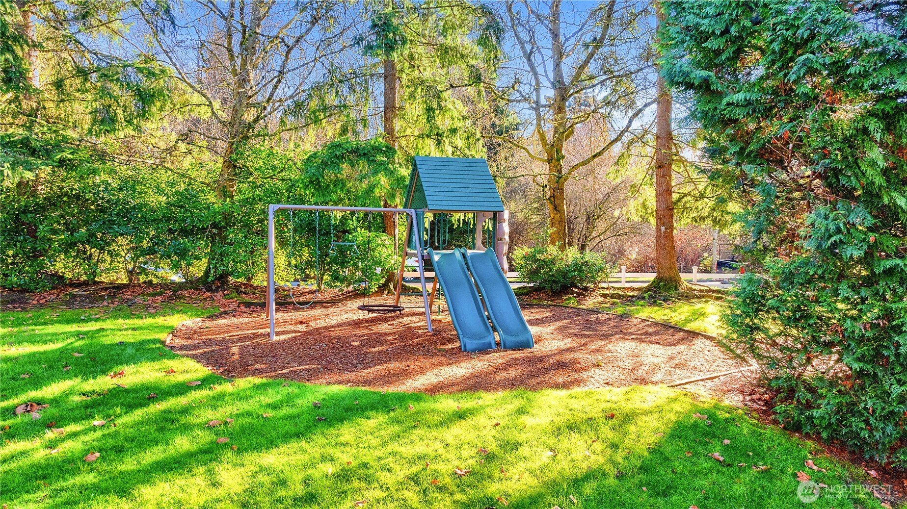 7453 Newcastle Golf Club Road, Unit G103 Newcastle, WA 98059 - Photo 29 of 37 a view of a yard with a tree