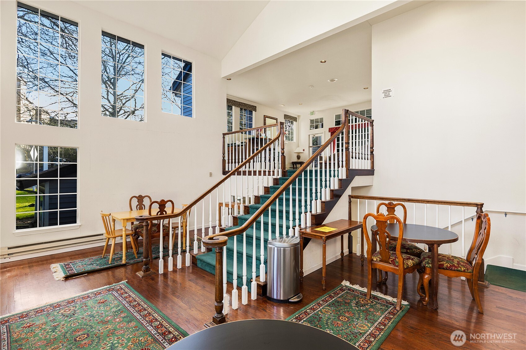 7453 Newcastle Golf Club Road, Unit G103 Newcastle, WA 98059 - Photo 36 of 37 a view of a dining room with furniture window and wooden floor