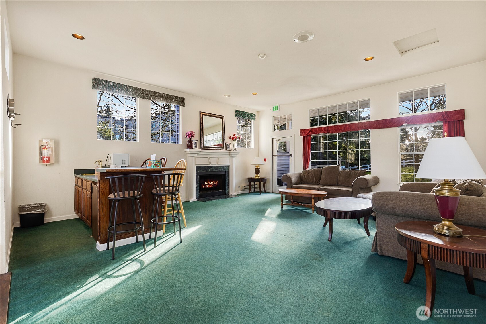 7453 Newcastle Golf Club Road, Unit G103 Newcastle, WA 98059 - Photo 37 of 37 a living room with furniture and a fireplace