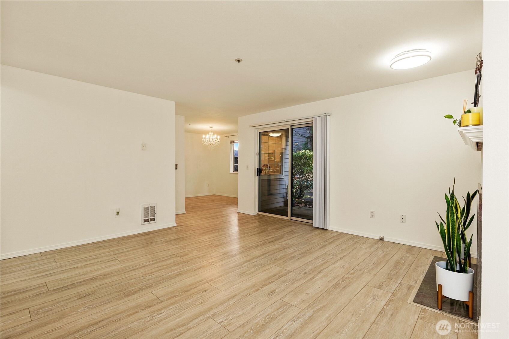 7453 Newcastle Golf Club Road, Unit G103 Newcastle, WA 98059 - Photo 8 of 37 a view of an empty room with wooden floor