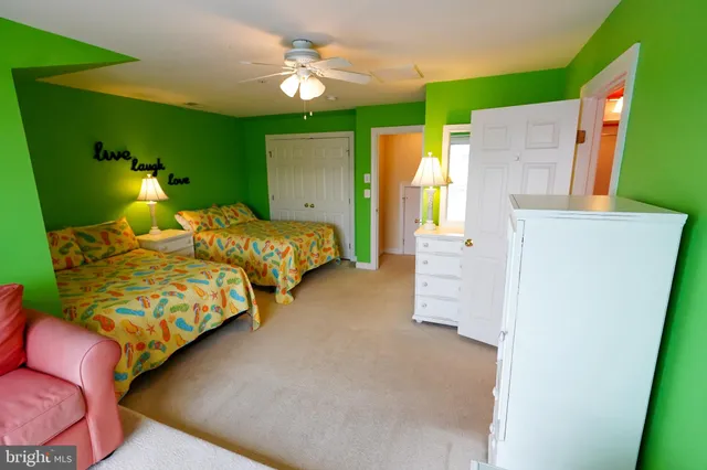 a bathroom with a toilet and a shower curtain