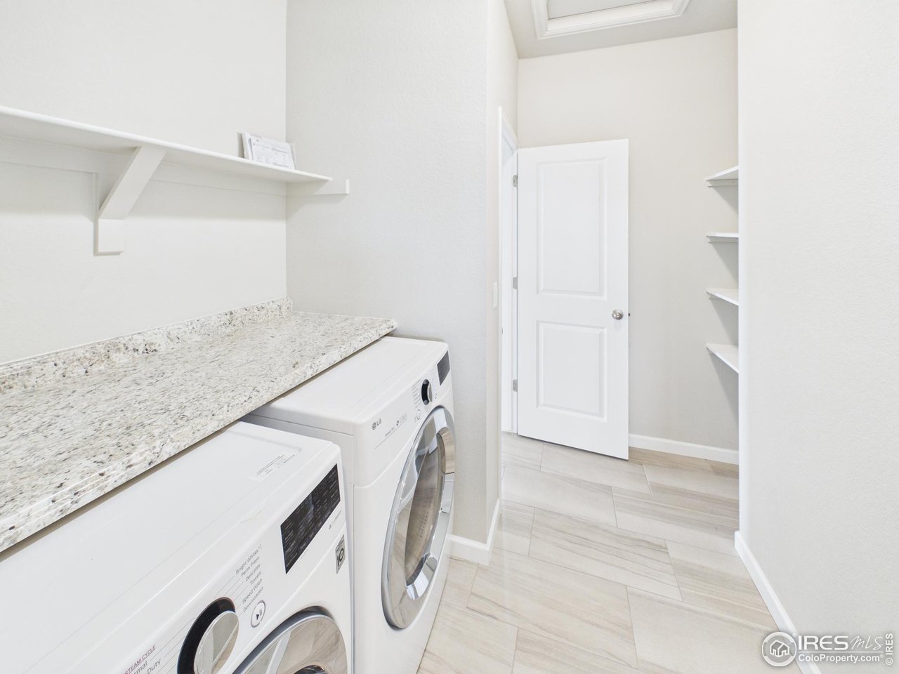 420 South 5th Street Berthoud, CO 80513 - Photo 29 of 47 a utility room with dryer and washer