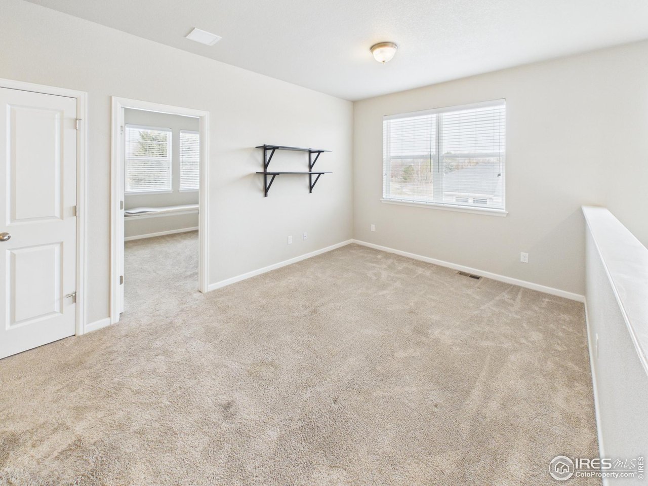 420 South 5th Street Berthoud, CO 80513 - Photo 31 of 47 an empty room with windows and closet