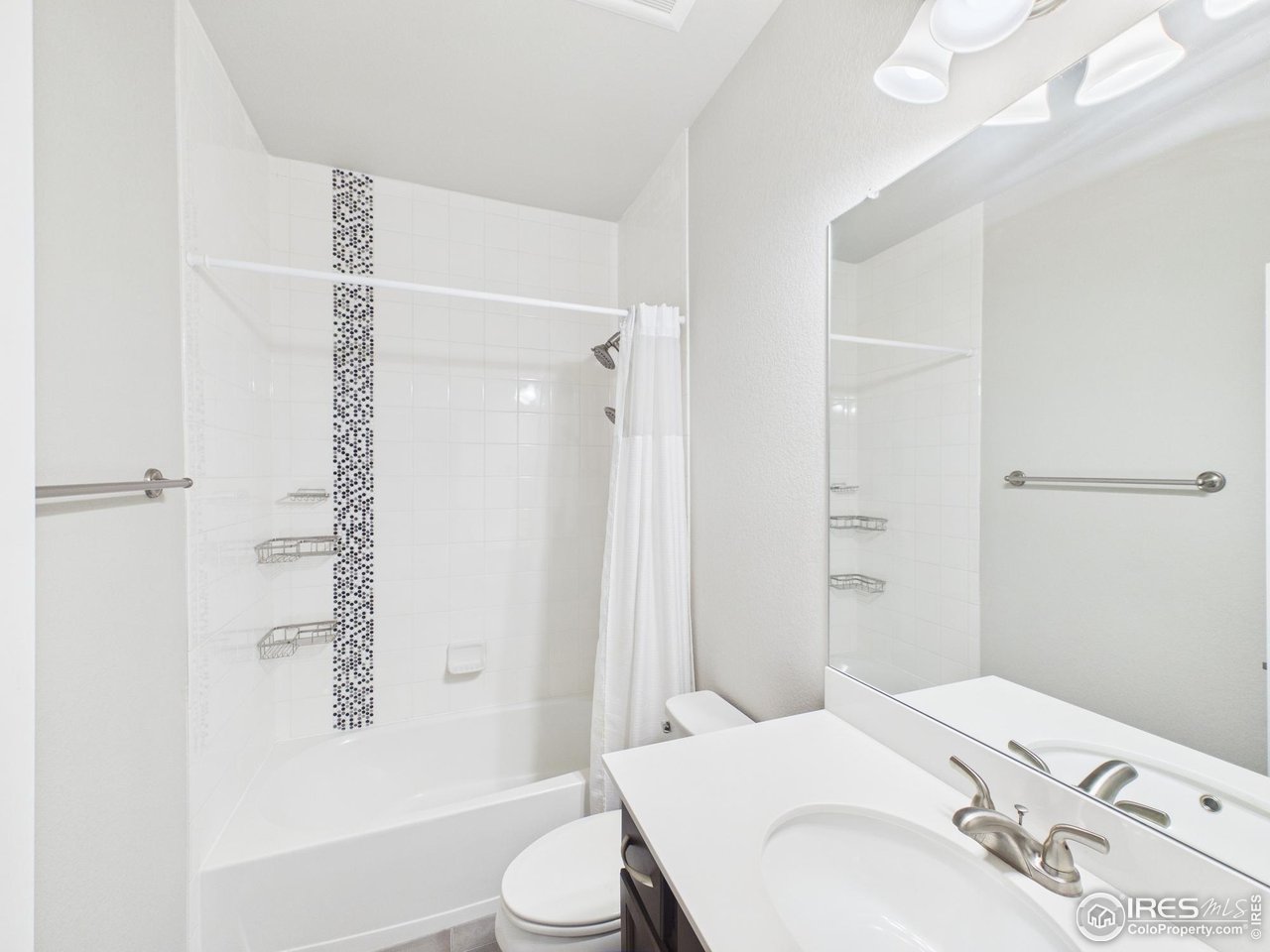 420 South 5th Street Berthoud, CO 80513 - Photo 35 of 47 a bathroom with a sink toilet and shower