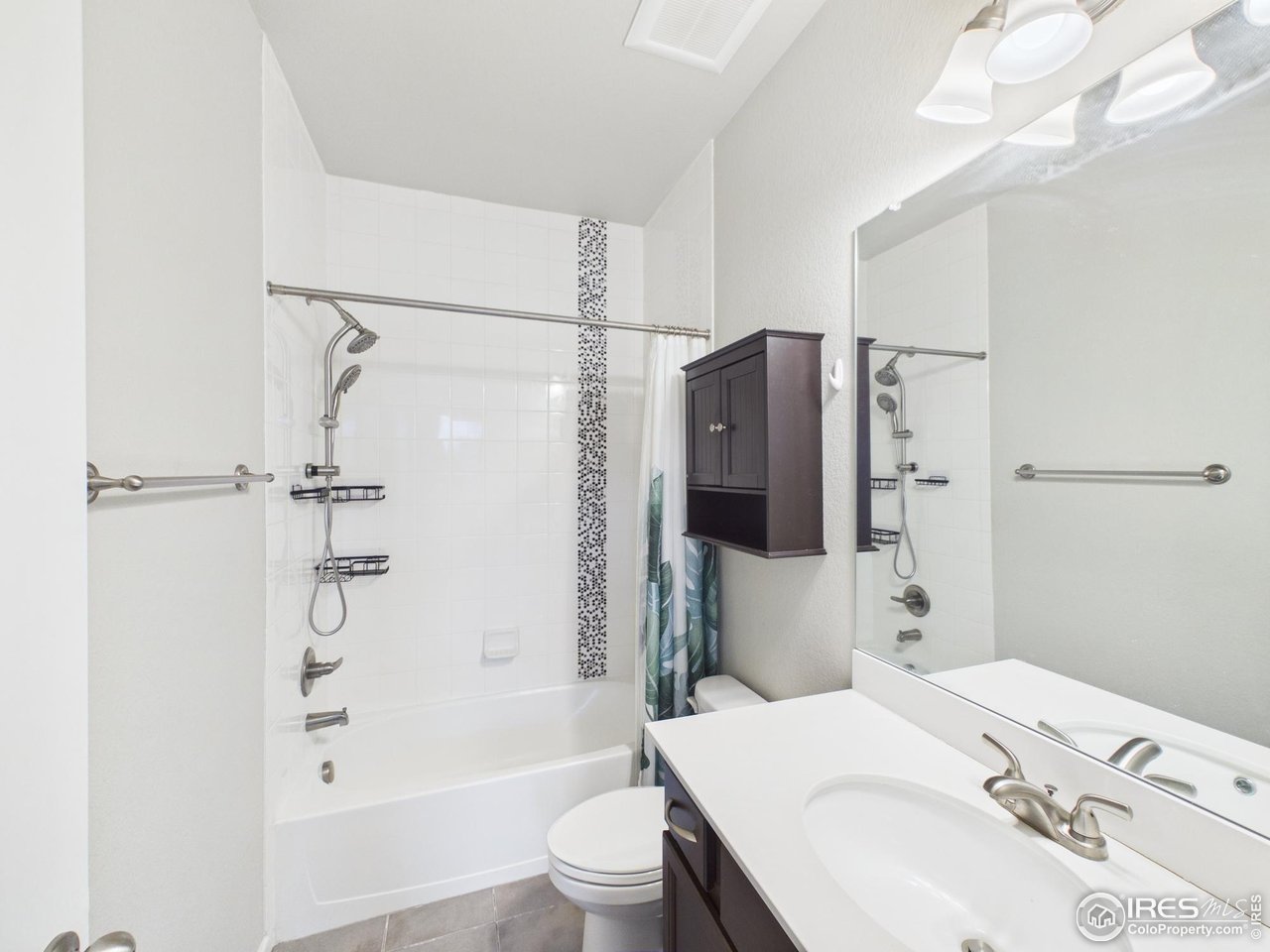 420 South 5th Street Berthoud, CO 80513 - Photo 37 of 47 a bathroom with a sink toilet and shower