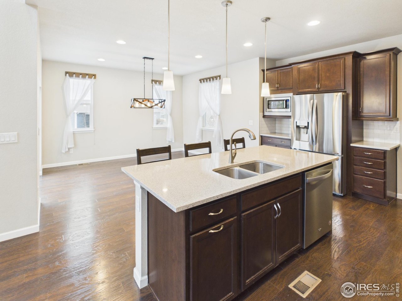 420 South 5th Street Berthoud, CO 80513 - Photo 5 of 47 a kitchen with a sink appliances and cabinets