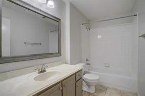 1304 Robin Street Houston, TX 77019 - Photo 8 of 11 Generous renovated bath with great storage, tub with shower.