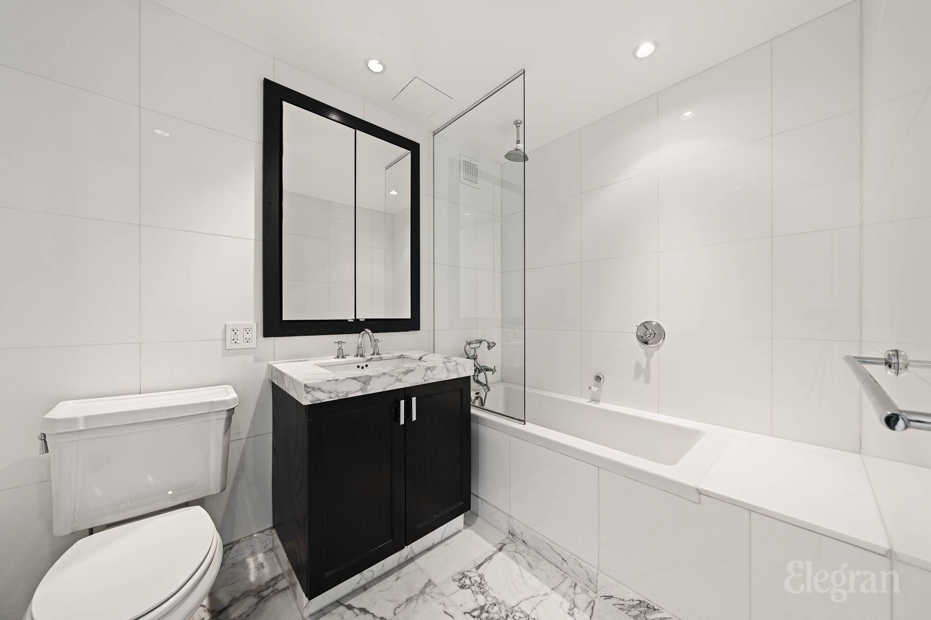 333 Rector Place, Unit 805 Manhattan, NY 10280 - Photo 12 of 28 a bathroom with a sink toilet and shower