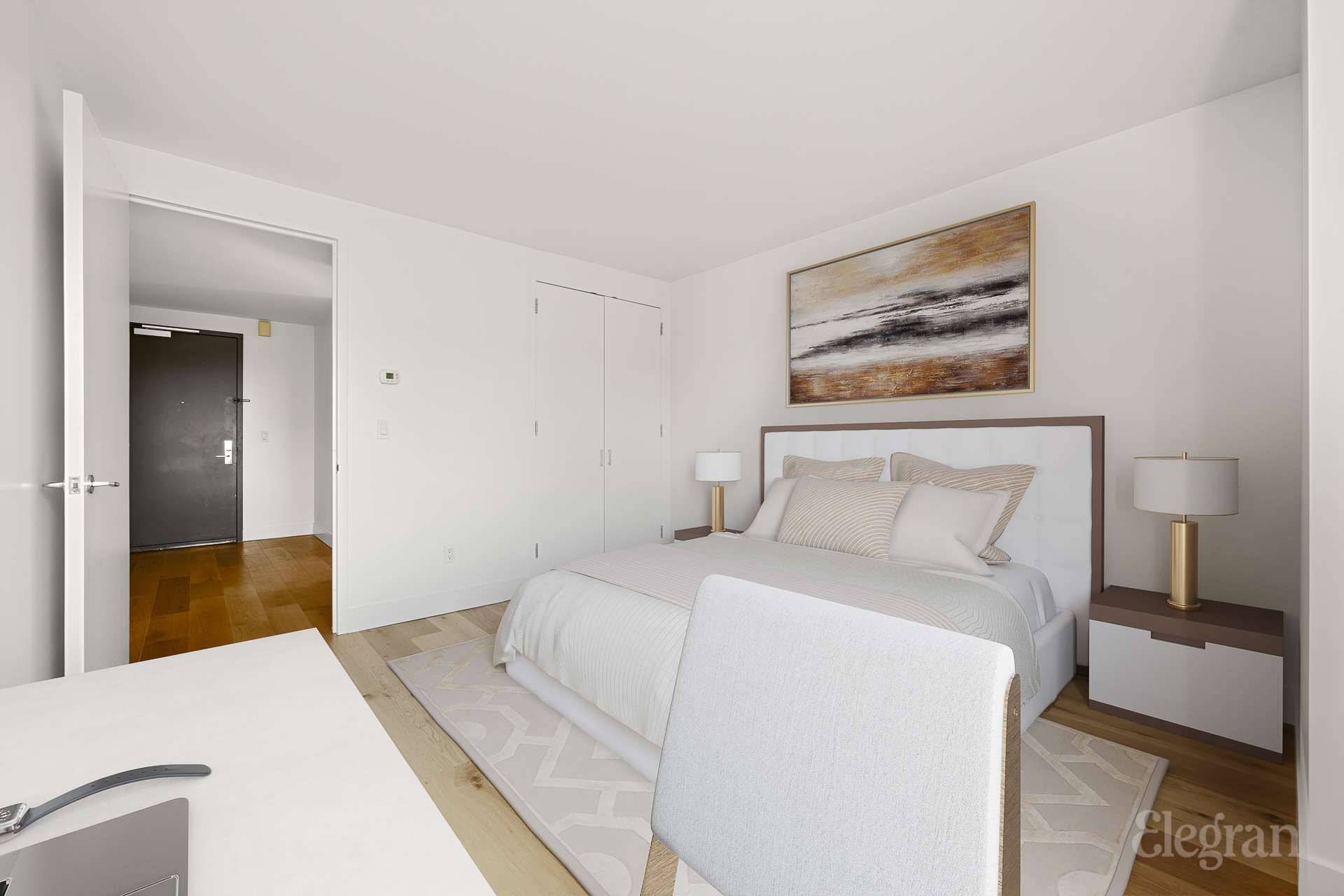 333 Rector Place, Unit 805 Manhattan, NY 10280 - Photo 20 of 28 a bedroom with a bed and a painting on the wall