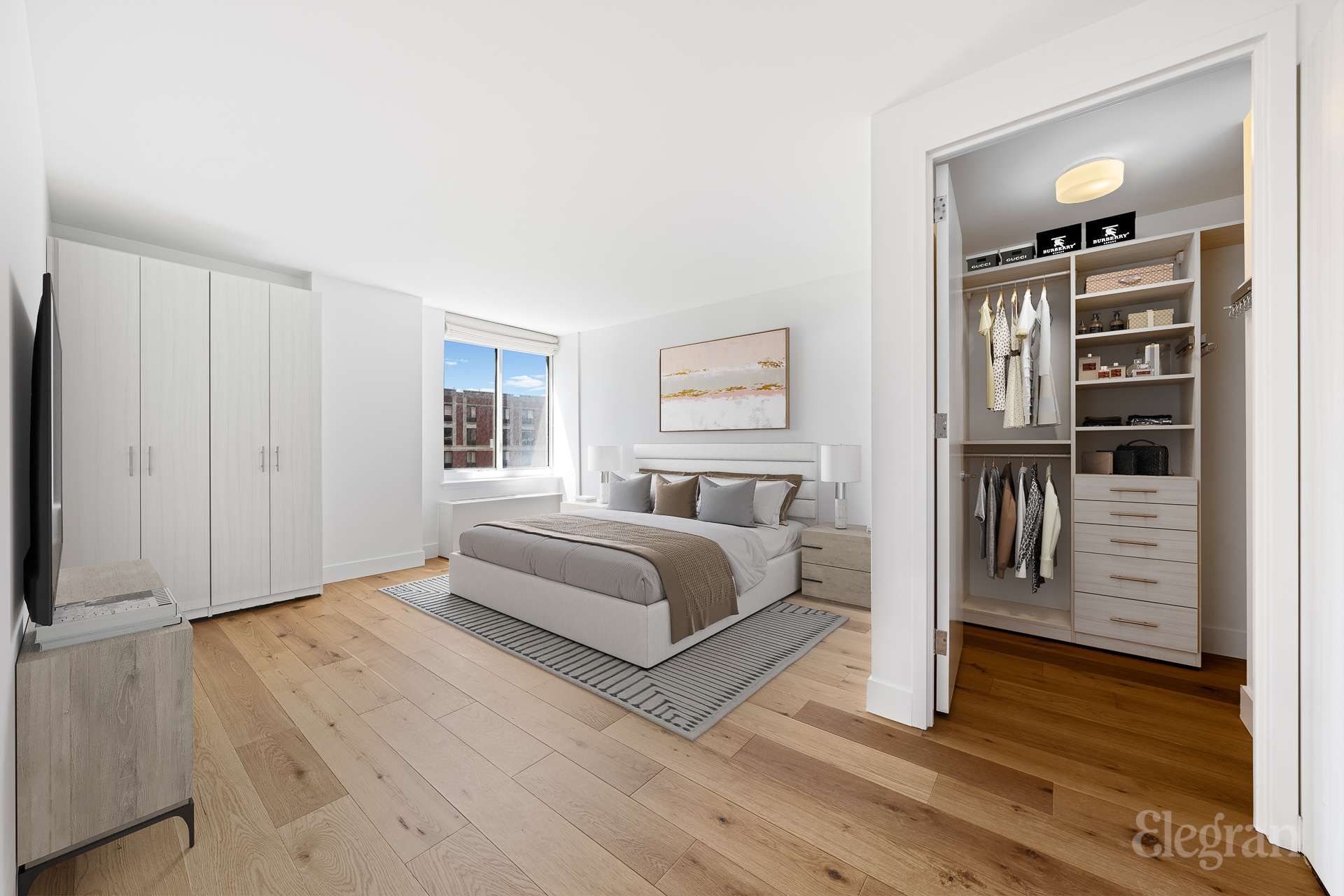 333 Rector Place, Unit 805 Manhattan, NY 10280 - Photo 22 of 28 a spacious bedroom with a bed and a window