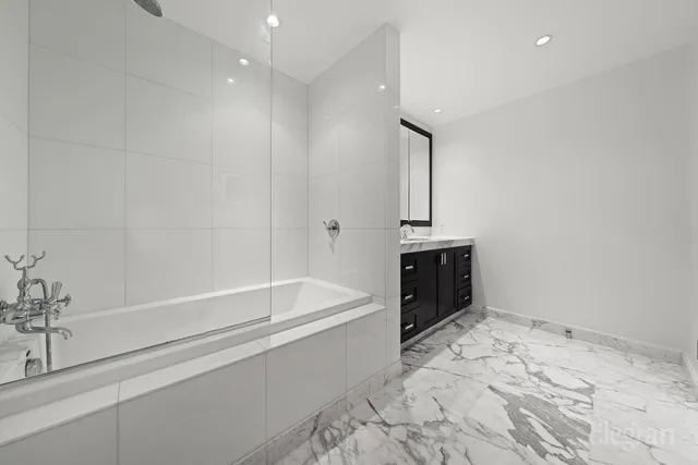 a bathroom with a bathtub and a sink