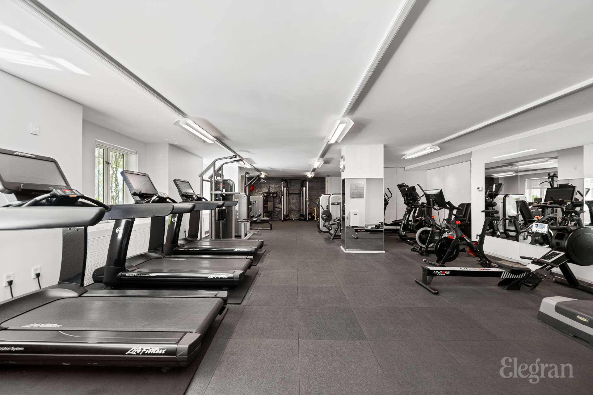 333 Rector Place, Unit 805 Manhattan, NY 10280 - Photo 27 of 28 a view of a room with gym equipment