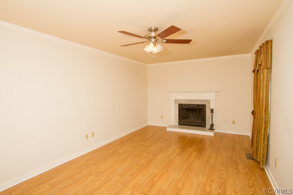 10422 White Rabbit Road North Chesterfield, VA 23235 - Photo 9 of 23 a view of an empty room with a fireplace and a window