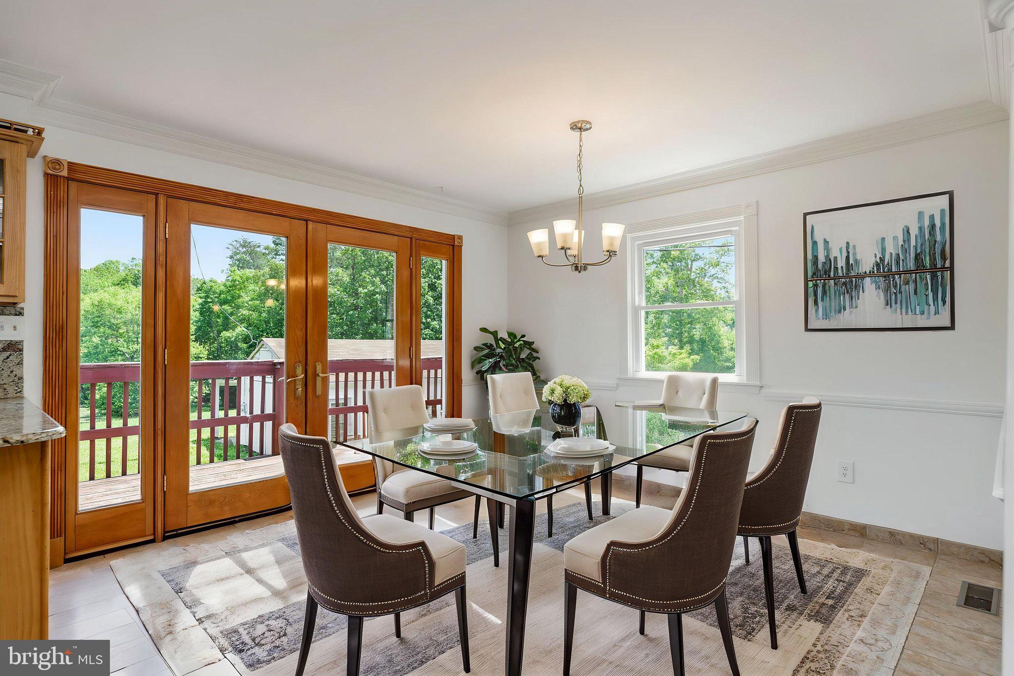 11325 Bacon Race Road Woodbridge, VA 22192 - Photo 11 of 54 a view of a dining room with furniture wooden floor and a chandelier