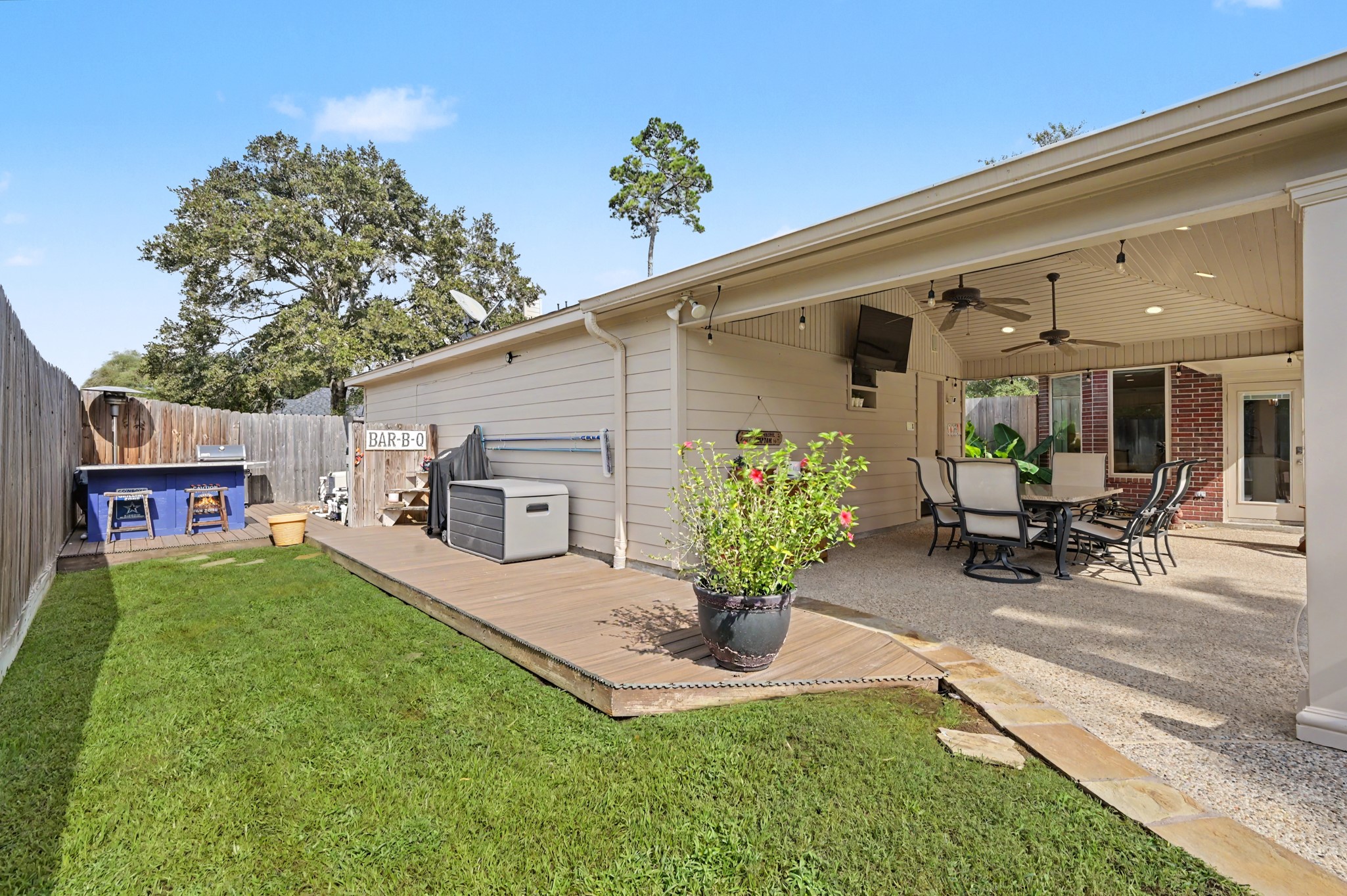 14938 Codys Run Cypress, TX 77429 - Photo 38 of 50 The current owner extended the decking and added a bar and a place to BBQ. The pool equipment is tucked back here, as well.