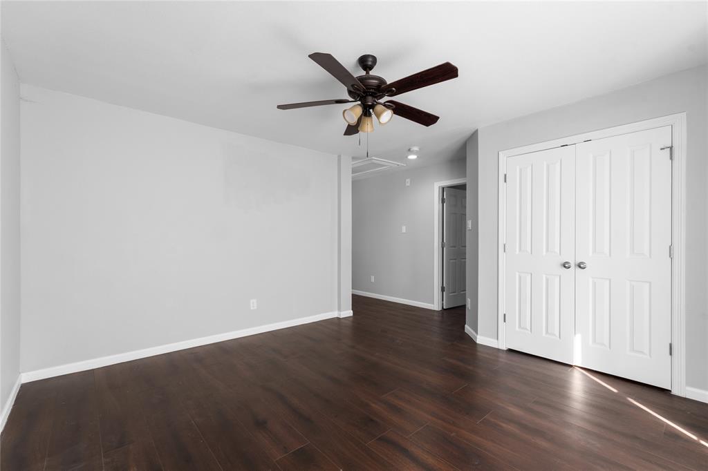 225 Freedom Court Rockwall, TX 75032 - Photo 20 of 28 a view of an empty room with wooden floor