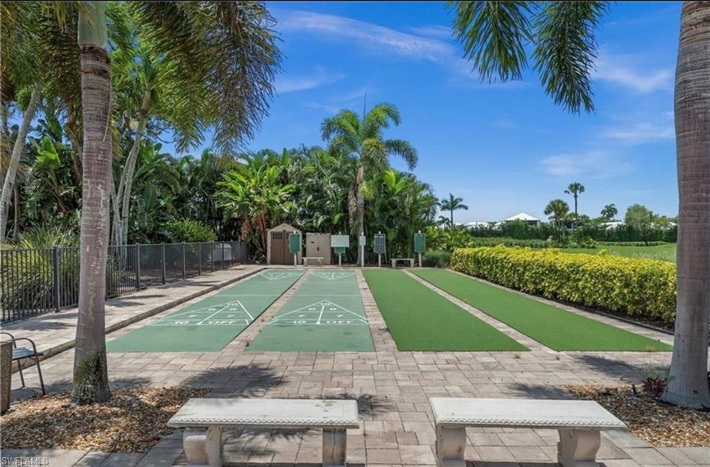 198 Albi Road, Unit 604 Naples, FL 34112 - Photo 34 of 38 View of home's community with shuffleboard and a storage shed