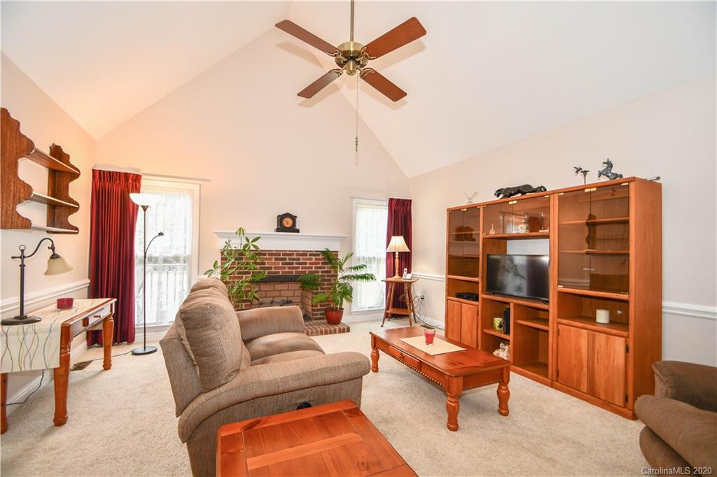 3400 Helms Pond Road Monroe, NC 28110 - Photo 12 of 24 a living room with furniture a ceiling fan and a rug