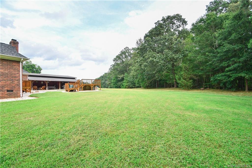 3400 Helms Pond Road Monroe, NC 28110 - Photo 3 of 24 a front view of house with yard and trees in the background