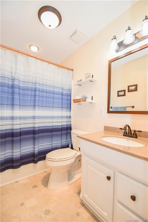 3400 Helms Pond Road Monroe, NC 28110 - Photo 24 of 24 a bathroom with a sink a toilet and mirror