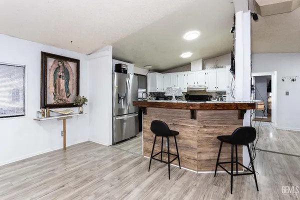 a kitchen with cabinets and appliances