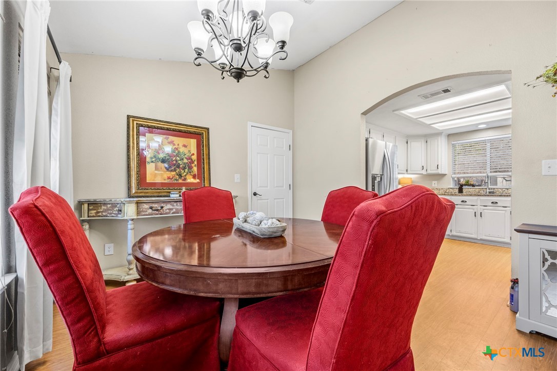 11207 Oak Tree Drive Salado, TX 76571 - Photo 10 of 34 Dining room with view into kitchen