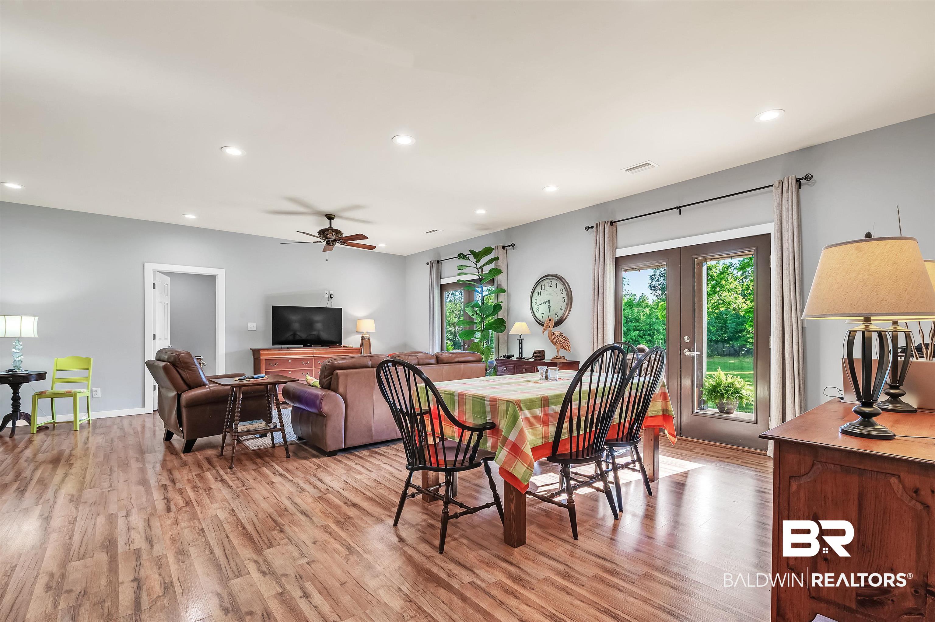 13827 County Road 83 Elberta, AL 36530 - Photo 17 of 38 Dining space with light wood finished floors, recessed lighting, french doors, a ceiling fan, and baseboards
