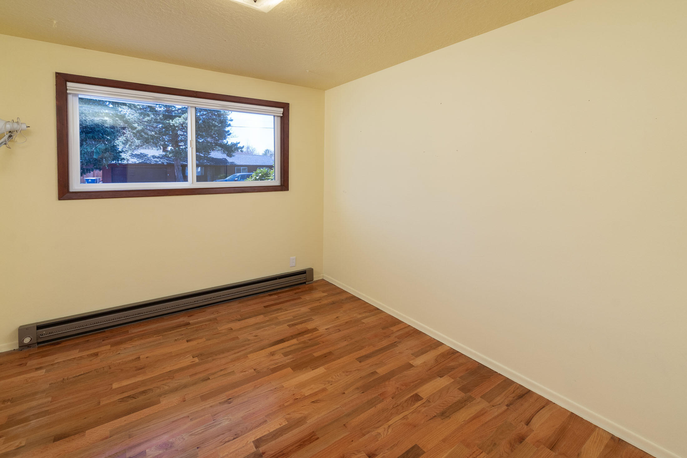 2188 Northeast Shepard Road Bend, OR 97701 - Photo 22 of 52 This bedroom has hardwood flooring in lovely condition, which is original in the home. The hardwood flooring is throughout the home preserved underneath the carpeting (except kitchen and bath) !