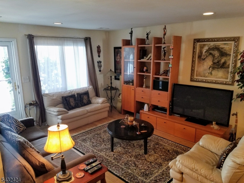 13 Ray Court Bedminster, NJ 07921 - Photo 2 of 8 a living room with furniture a rug and a large window