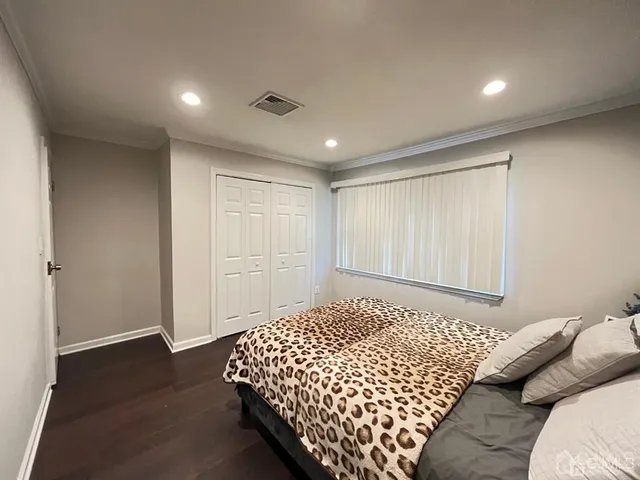 a bedroom with bed and window